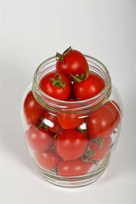 Cherry Tomatoes In Glass Jar Over White Stock Image Image Of Closeup