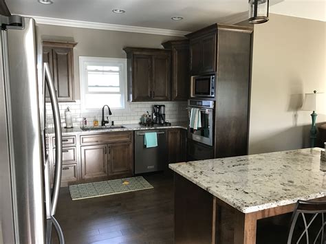 This cool color will accent the warm tones in your honey oak cabinets and create a nice contrast to the rich orange hues. Dark Walnut stained cabinets, Alaska White Granite. W… | Tile backsplash kitchen dark cabinets ...