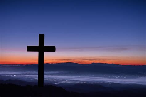 Silhouette Of Cross On Mountain Sunrise Background 7778081 Stock Photo