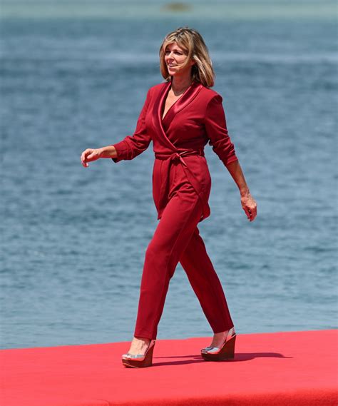 kate garraway 52 flashes her legs after 14lb weight loss in daring red playsuit after three