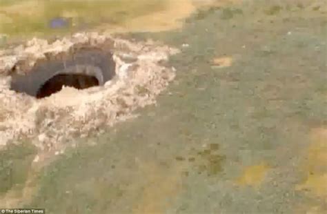 Giant Hole Appears In Siberia Huge Crater Emerges In The End Of The World Daily Mail Online
