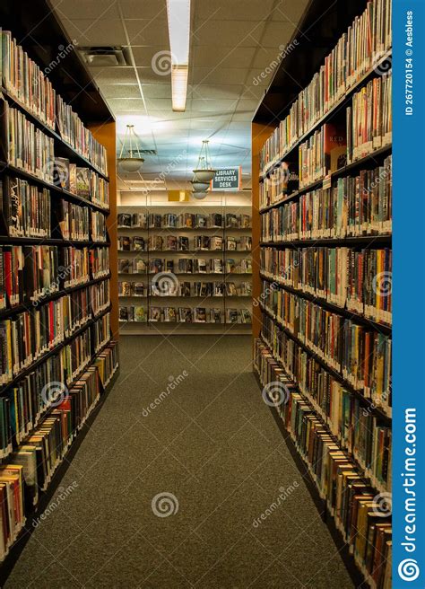 Aisle Of Books On Bookshelves In Public Library Editorial Stock Image