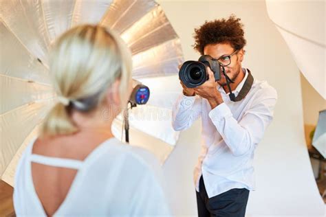 Photographer Takes Portrait Photo In Photo Studio Stock Image Image