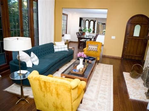 Yellow Chairs And Teal Sofa In Tudor Living Room Teal Living Room
