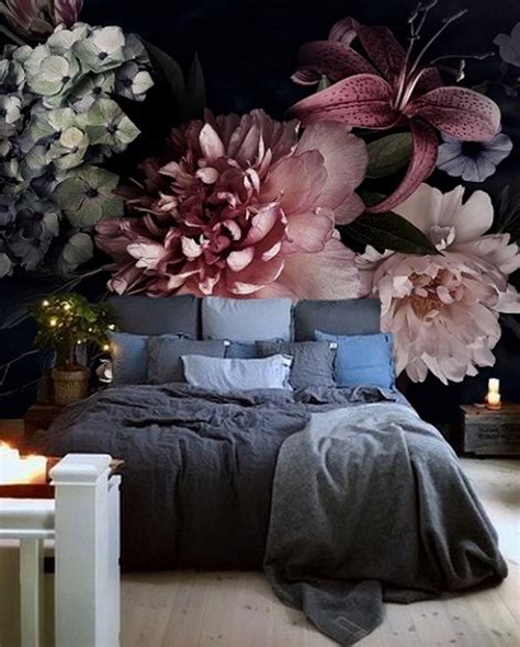 A Bedroom With Flowers On The Wall And Candles In The Floor Next To It