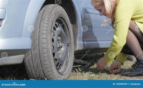 Seductive Blonde Woman Trying Change Wheel On A Car On Rural Road K Stock Video Video Of