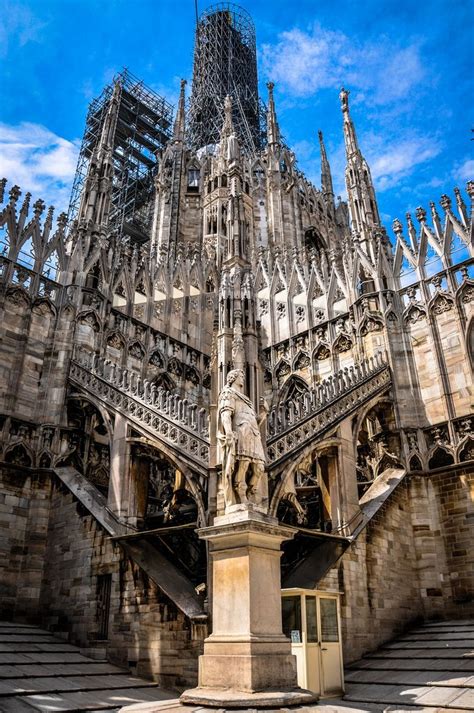 Sculpture And Courtyard On The Terrace Of The Duomo Di Milano Milan