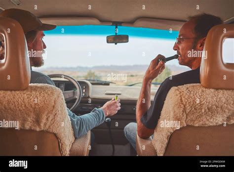 This Road Trip Couldnt Get Any Better Two Men Smoking Together While