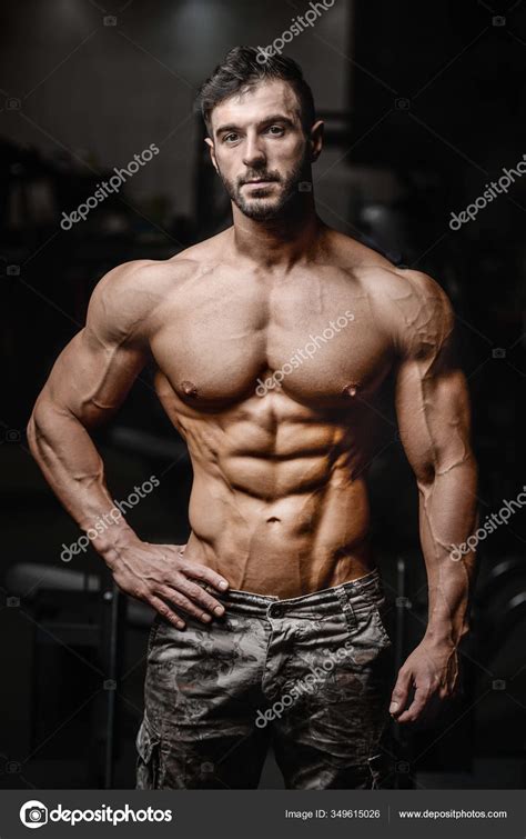 Bodybuilder Torso Arms Ripped Abs Pecs Nipple Piercing Wearing Jeans Stock Photo By Yayimages