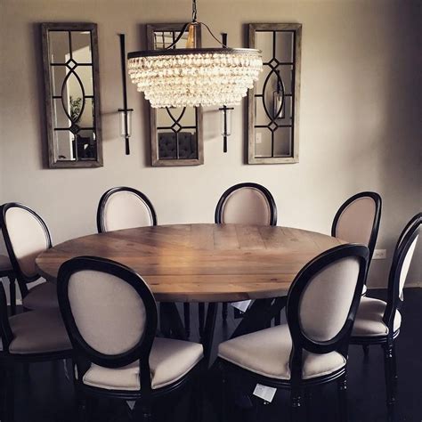 All wood are in an antique black rustic finish. Hand Made 72" Round Reclaimed Wood Dining Table by Reclaimed | CustomMade.com
