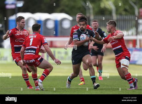 Ashton Golding #5 of Huddersfield Giants runs at the Hull KR defence