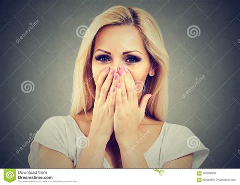 portrait of a happy woman being shy laughing and covering face with hands stock image image of