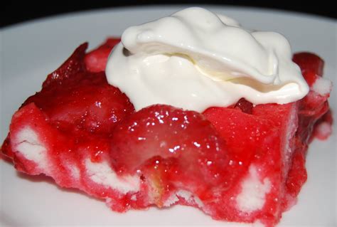 Turn angel food cake upside down poke holes with fork and press down in the jello mixture. Strawberry Angel Dessert