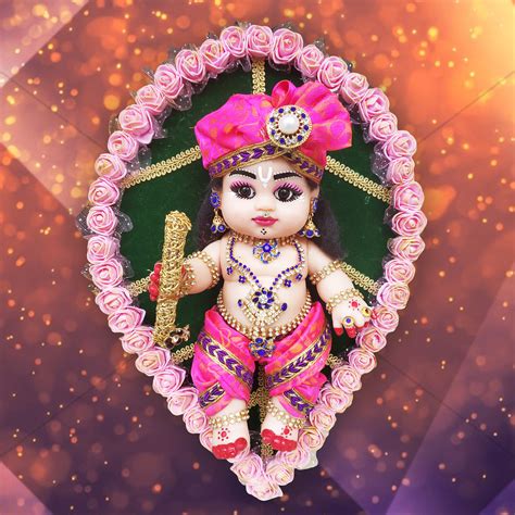 Baby Krishna sitting on a leaf doll | Trogons