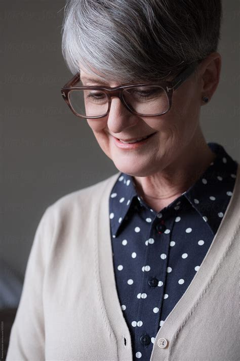 Portrait Of Mature Woman With Natural Grey Hair Wearing Casual Business Attire By Stocksy