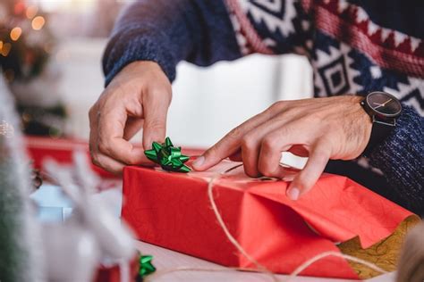 Premium Photo Men Wrapping Christmas Ts