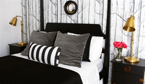 The twin size bed with charcoal gray skirting, white linens and graphic printed pillows are perfect complements to the white and gray printed accent rug at the center of the room. Black and Gray Bedroom - Eclectic - bedroom - Bryn ...