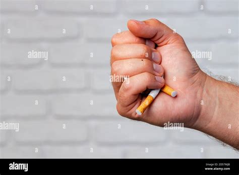 Male Hand Breaking Cigarettes Close Up Quitting Habit Stock Photo Alamy