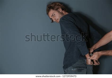 Man Putting Handcuffs On Drug Dealer Stock Photo Shutterstock