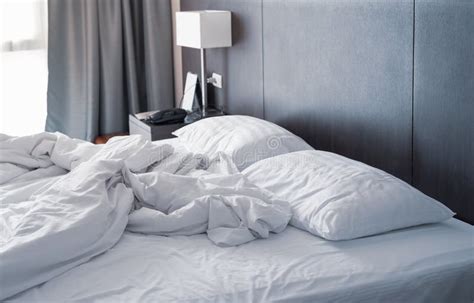 Messy And Unmade White Hotel Bed At Hotel Room In Holiday Morning Stock Photo Image Of Motel