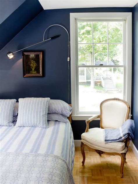 This lovely light blue wall color gives the white bedroom dã©cor a sterile look that is also attractive. Dark Blue Bedroom Home Design Ideas, Pictures, Remodel and ...