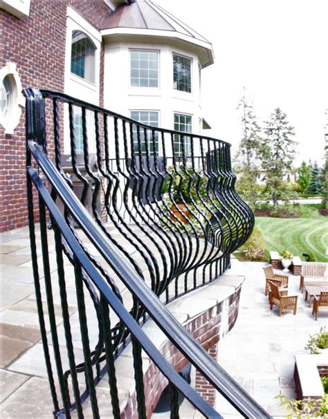 Curved Exterior Staircase With Wrought Iron Balcony Rail Traditional