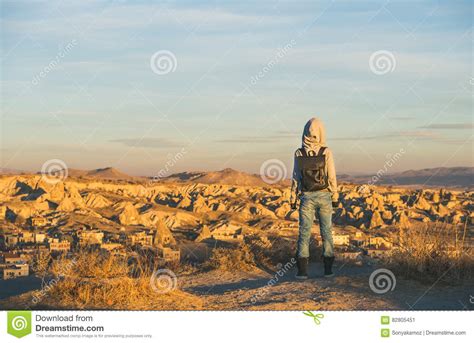 Young Woman Traveller In Hoodie Watching Sunrise