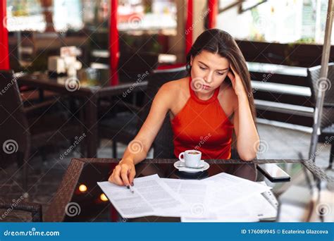 Headache Girl Sitting In A Cafe With A Cup Of Coffee Working Environment Stock Image Image