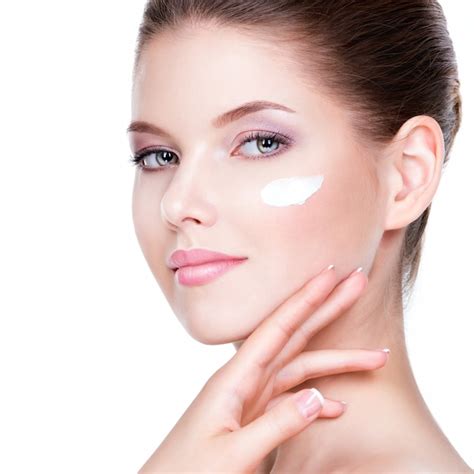 Free Photo Beauty Face Of Young Woman With Cosmetic Cream On A Cheek