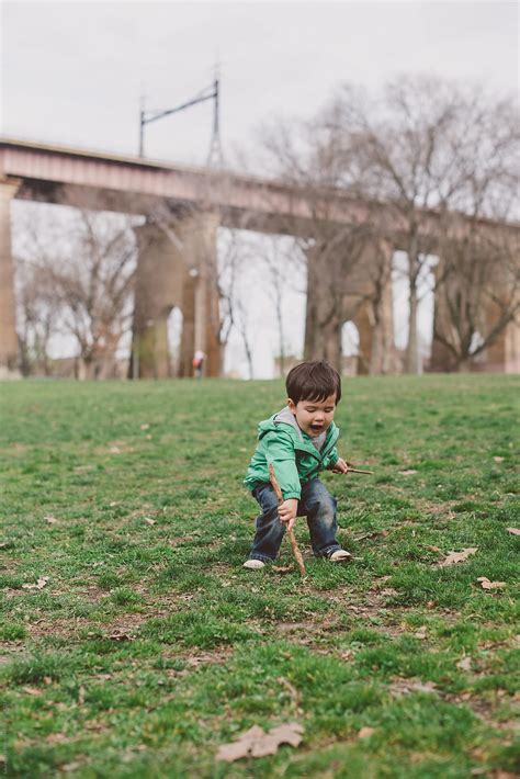 Little Kid Playing In The Park By Stocksy Contributor Lauren Lee