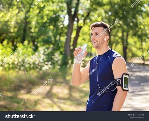 Sporty Man Drinking Water Park Stock Photo 1141207712 Shutterstock