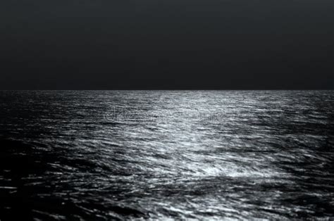 Sea Horizon At Night Moonlight On The Waves Long Exposure Stock Photo