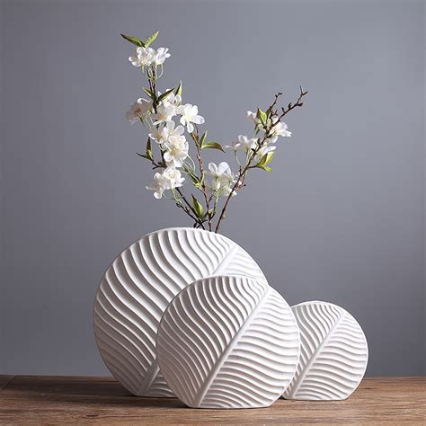 Our assortment of inlay marble flower vase are available at industrial leading price. Leaf shape design ceramic flower vase Modern noric fashion ...