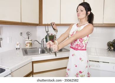 Beautiful Brunette Housewife Working Her Kitchen Stock Photo