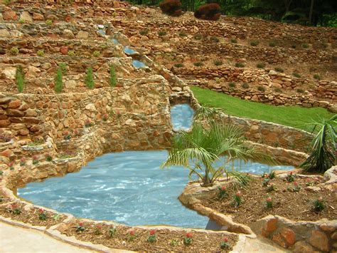Awesome Retaining Wall With A Waterfall Leading Into A Pool