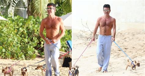simon cowell keeps up his exercise with topless beach stroll is he ever coming back metro news