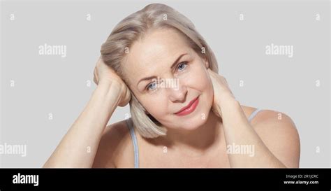Beautiful Middle Aged Blonde Woman Shows Off Her Perfectly Well Groomed Face Macro Face