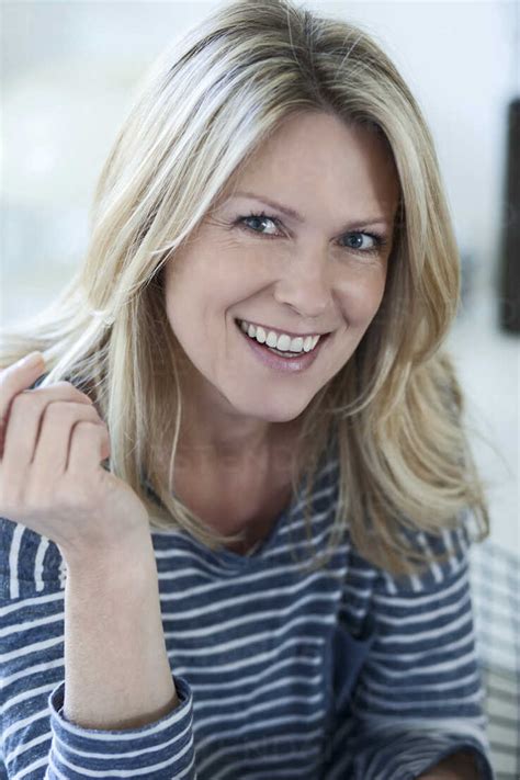 Portrait Of Smiling Blond Woman Stock Photo