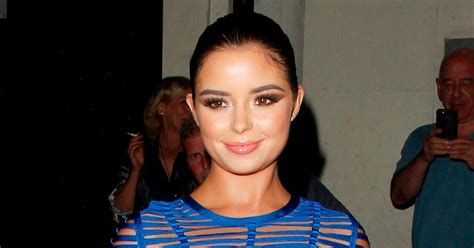 Demi Rose Mawby Struggles To Contain Her Ample Cleavage In Outrageously Raunchy Dress At London