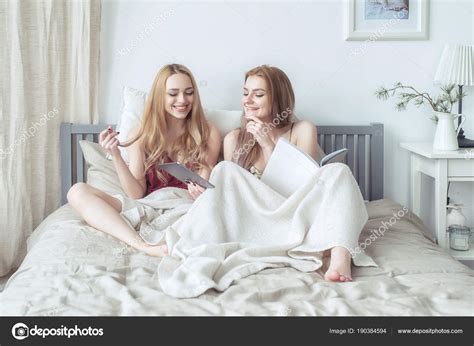 Two Sexy Blonde Girls In Pyjamas Having Fun In The Bedroom Young
