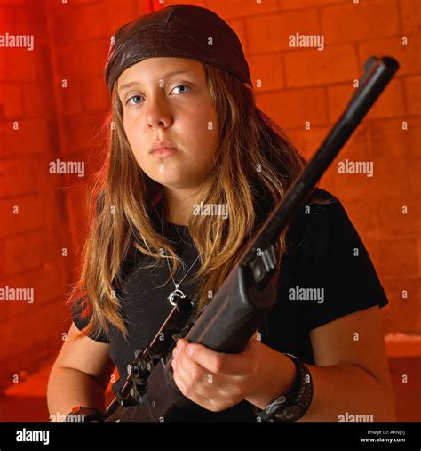 Image Of Young Teenage Girl Holding Rifle Stock Photo Alamy