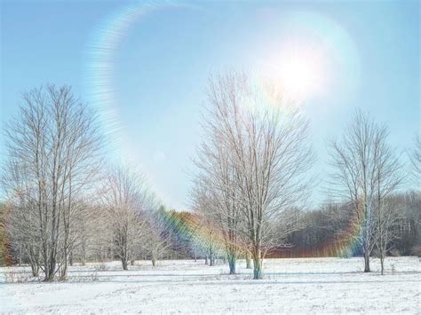 From a scientific perspective, a circular rainbow, a halo, is a type of optical phenomenon, forming a circle 22° around the sun. Rainbow Sun Halo Photograph by Susan Hope Finley