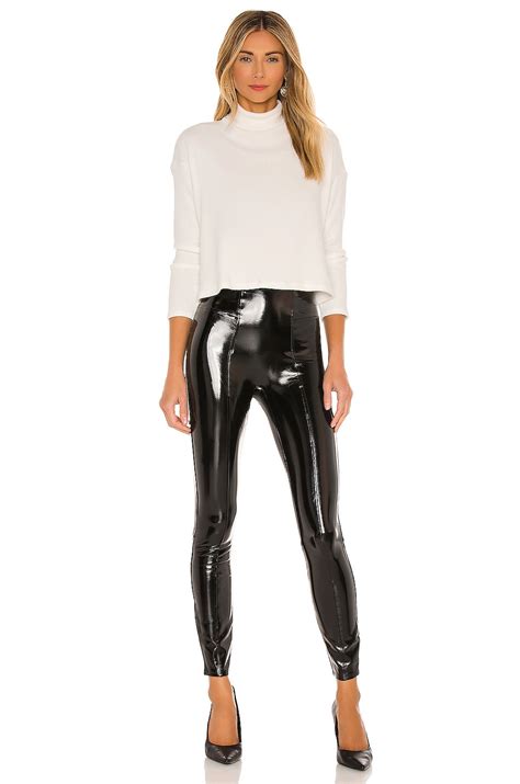 spanx faux patent leather leggings in black revolve