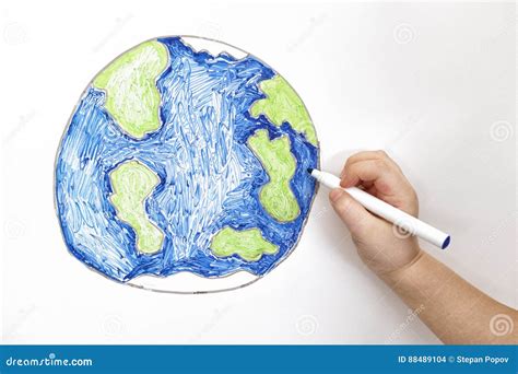 Child S Hand Drawing Planet Earth With A Marker Stock Photo Image Of