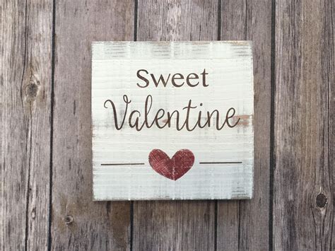 A Wooden Sign That Says Sweet Valentine On It