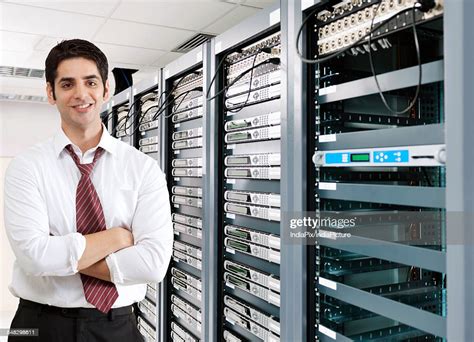 Smiling Businessman In Server Room High Res Stock Photo Getty Images