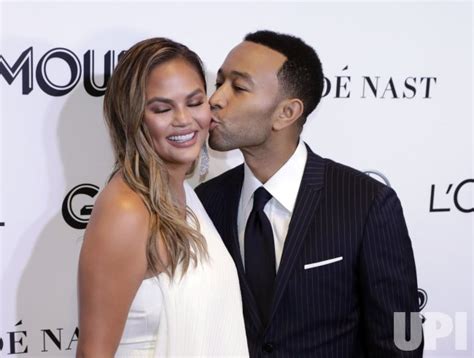 Photo John Legend Kisses His Wife Chrissy Teigen As They Arrive To The 2018 Glamour Women Of