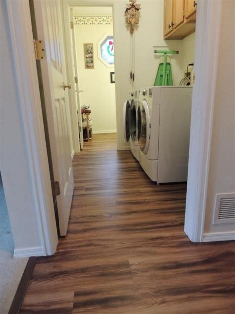 Vinyl flooring of this sort is easily installed and looks good. Beautiful laundry room style that's affordable - and you ...