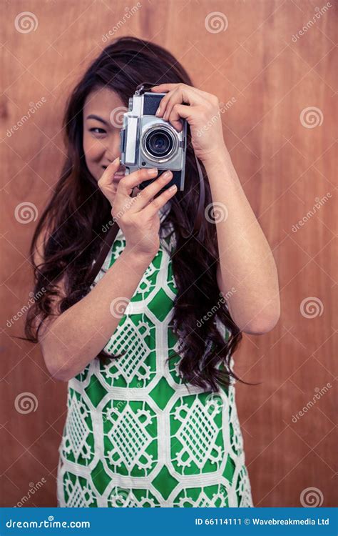smiling asian woman taking photograph with camera stock image image of beautiful japanese