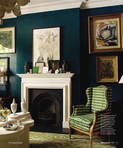 Dark Teal Wall With Cream Crown Molding And Fireplace